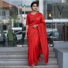 Red Hand Embroidered Silk Saree, draped and worn by a woman, AI visual of the saree, iTokri