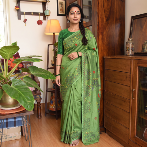 Green Hand Embroidered Silk Saree, draped and worn by a woman, AI visual of the saree, iTokri