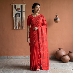 Red Hand Embroidered Silk Saree, draped and worn by a woman, AI visual of the saree, iTokri