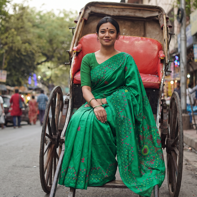 Green Hand Embroidered Silk Saree, draped and worn by a woman, AI visual of the saree, iTokri