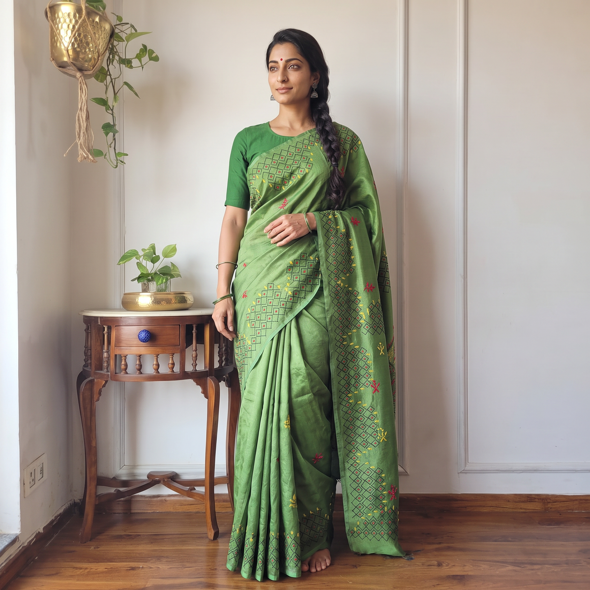 Green Hand Embroidered Silk Saree, draped and worn by a woman, AI visual of the saree, iTokri
