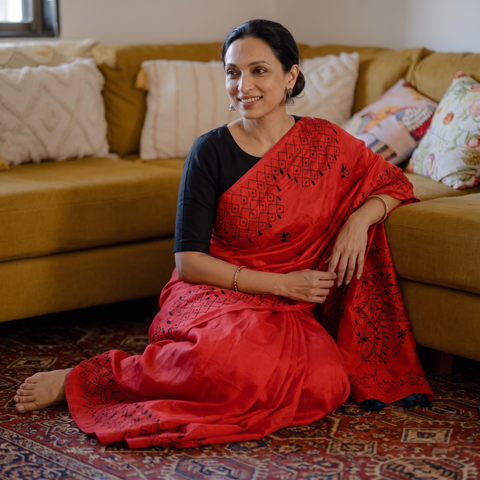 Red Hand Embroidered Silk Saree, draped and worn by a woman, AI visual of the saree, iTokri