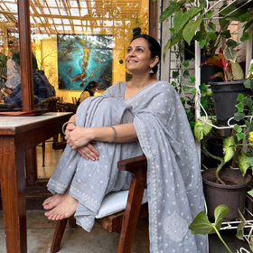 Grey Hand Embroidered Terivoile Cotton Lucknow Chikan Saree, draped and worn by a woman, AI visual of the saree, iTokri