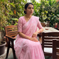 Pink Hand Embroidered Terivoile Cotton Lucknowi Chikankari Saree, draped and worn by a woman, AI visual of the saree, iTokri