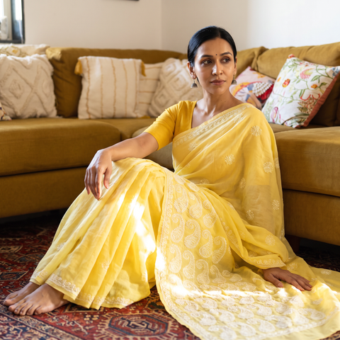 Yellow Hand Embroidered Terivoile Cotton Lucknowi Chikankari Saree, draped and worn by a woman, AI visual of the saree, iTokri