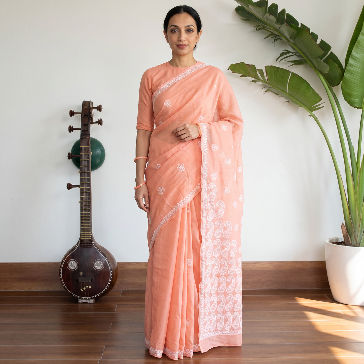 Peach Hand Embroidered Terivoile Cotton Lucknowi Chikankari Saree, draped and worn by a woman, AI visual of the saree, iTokri