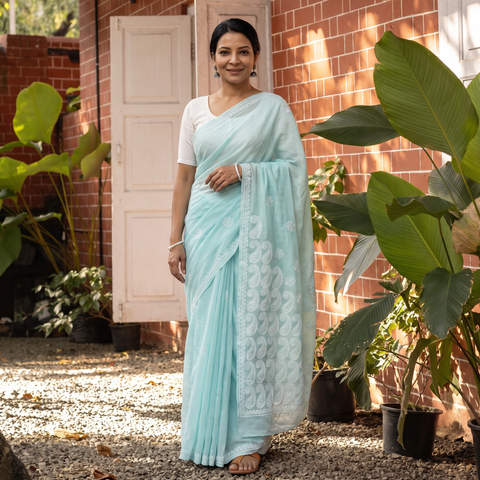 Blue Hand Embroidered Terivoile Cotton Lucknowi Chikankari Saree, draped and worn by a woman, AI visual of the saree, iTokri
