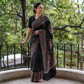 Black Hand Embroidery Chanderi Silk Kashida Saree with Zari Border, draped and worn by a woman, AI visual of the saree, iTokri