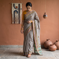Grey Hand Embroidery Kerala Cotton Kashida Saree with Zari Border, draped and worn by a woman, AI visual of the saree, iTokri