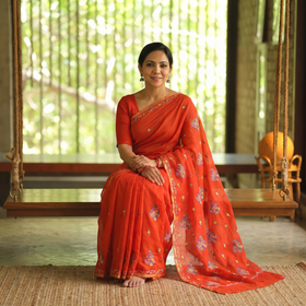 Orange Hand Embroidery Pure Chanderi Silk Block Printed Kashida Saree, draped and worn by a woman, AI visual of the saree, iTokri