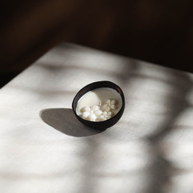 Handcrafted eco-friendly coconut shell jasmine soy scented