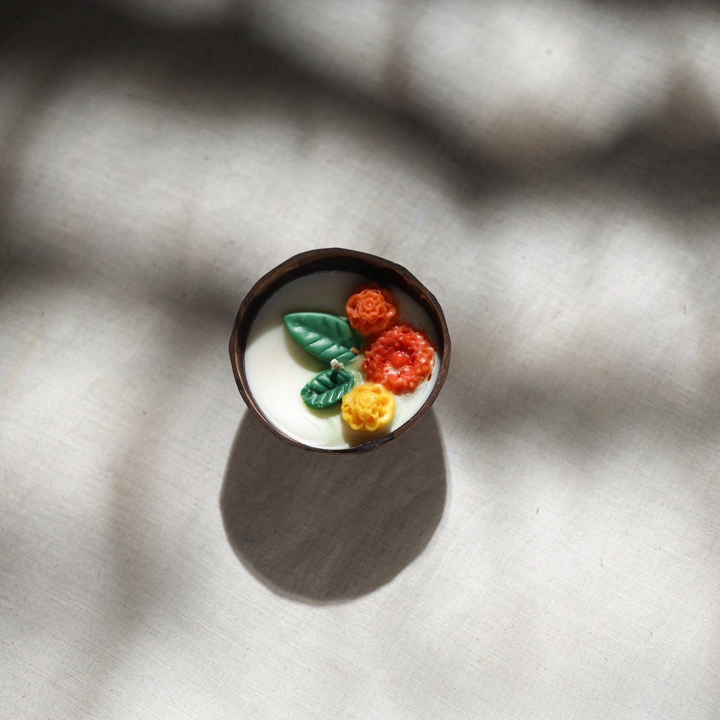 Handcrafted eco-friendly coconut shell marigold soy scented