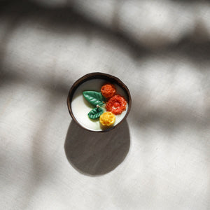 Handcrafted eco-friendly coconut shell marigold soy scented