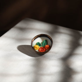 Handcrafted eco-friendly coconut shell marigold soy scented