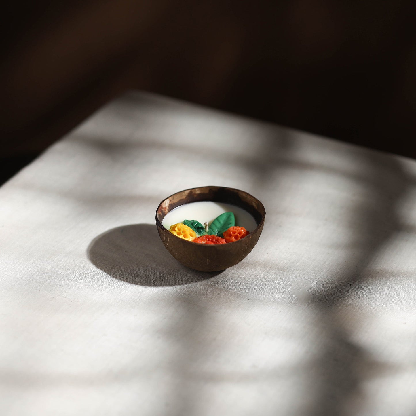 Handcrafted eco-friendly coconut shell marigold soy scented