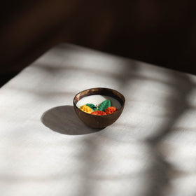 Handcrafted eco-friendly coconut shell marigold soy scented