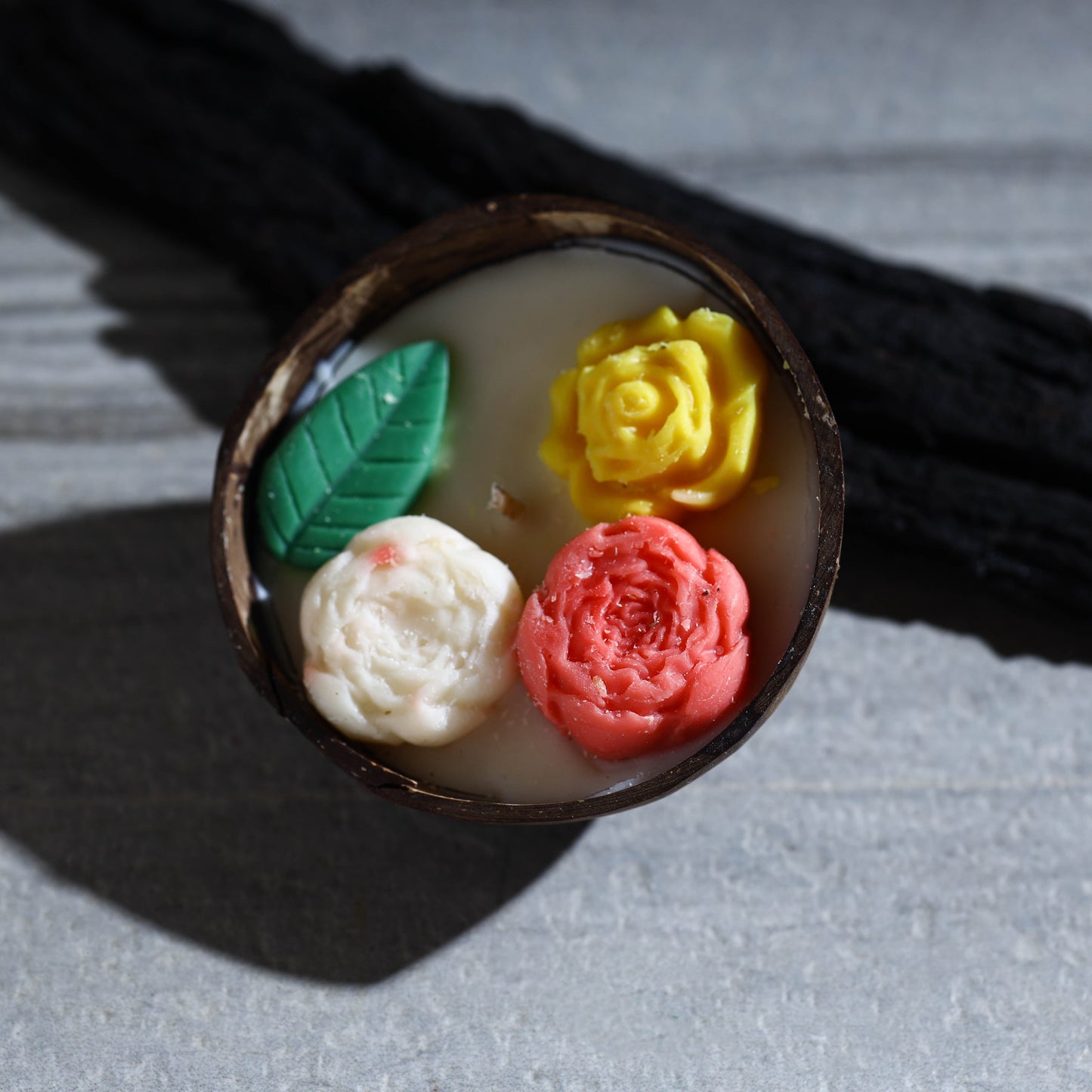 Handcrafted eco-friendly coconut shell rose soy scented