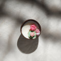 Handcrafted eco-friendly coconut shell rose soy scented