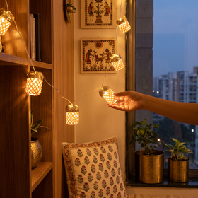 Handcrafted Jyoti Bamboo String Light (3M), lit in a home in the evening, AI visual of the light, iTokri