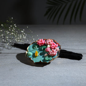 Handcrafted metal urli water lily pond soy wax scented