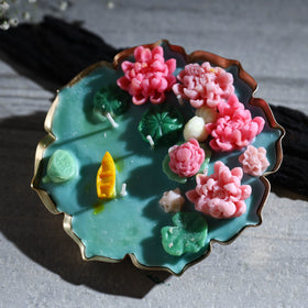 Handcrafted metal urli water lily pond soy wax scented