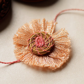  Handcrafted Pine Needles Hibiscus Rakhi by Pirul 