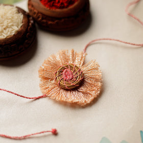  Handcrafted Pine Needles Hibiscus Rakhi by Pirul 