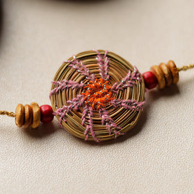  Handcrafted Pine Needles Hibiscus Rakhi by Pirul 