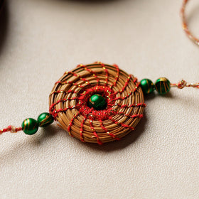  Handcrafted Pine Needles Hibiscus Rakhi by Pirul 