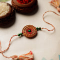  Handcrafted Pine Needles Hibiscus Rakhi by Pirul 