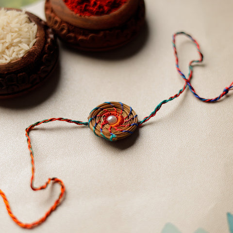  Handcrafted Pine Needles Hibiscus Rakhi by Pirul 