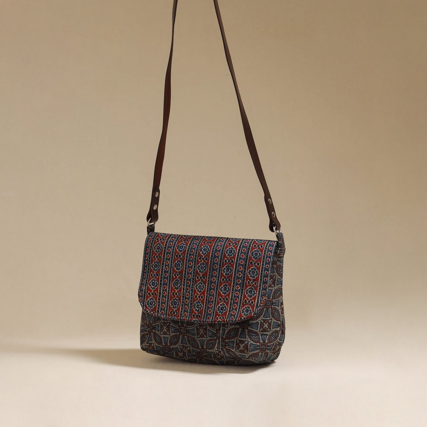 Handcrafted quilted ajrakh block printed fabric sling bag