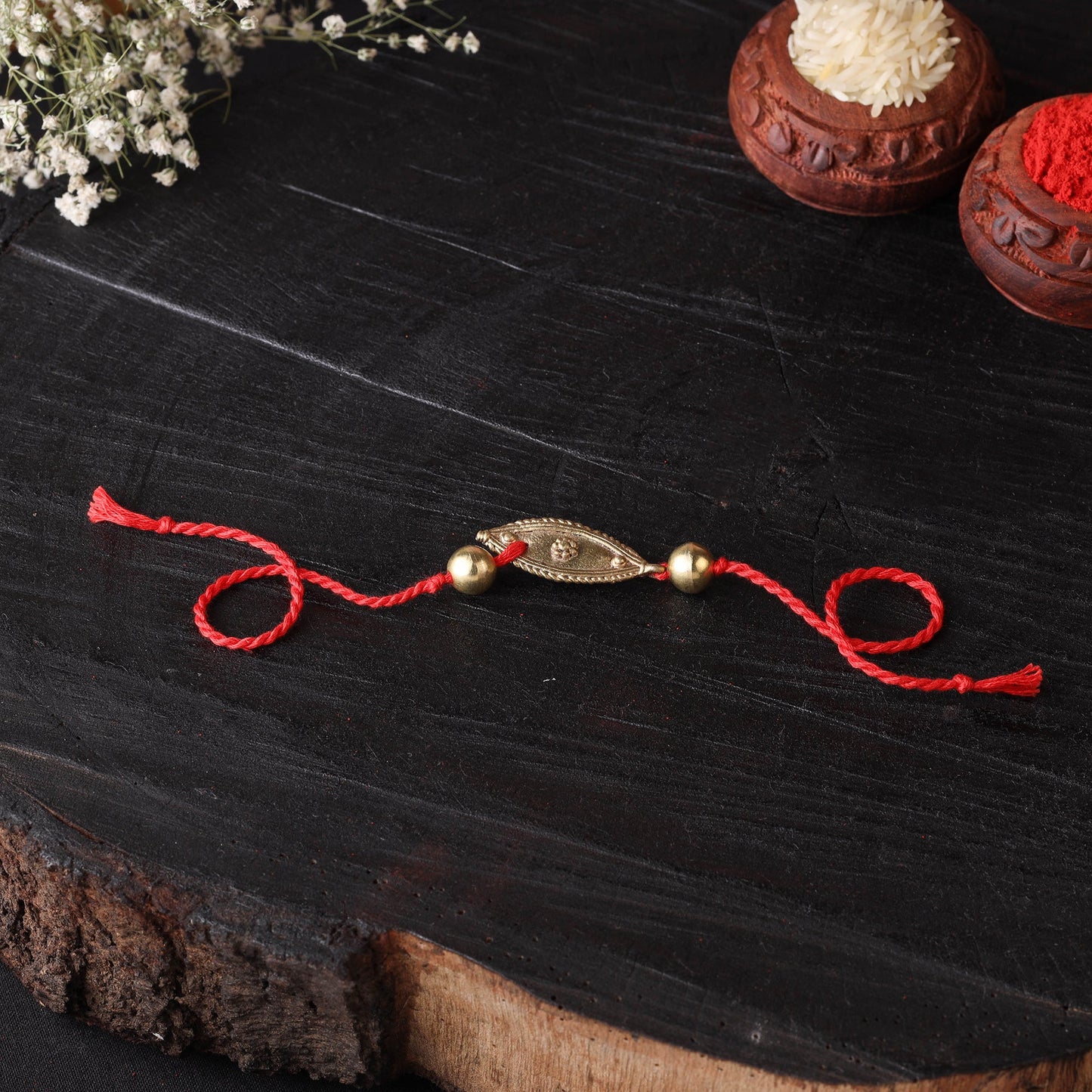 Handcrafted tribal dokra brass thread rakhi 02