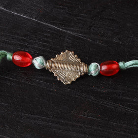 Handcrafted tribal dokra brass thread rakhi 03