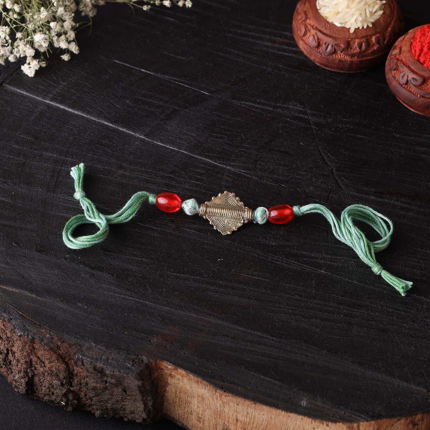 Handcrafted tribal dokra brass thread rakhi 03
