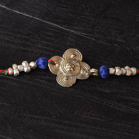 Handcrafted tribal dokra brass thread rakhi 04