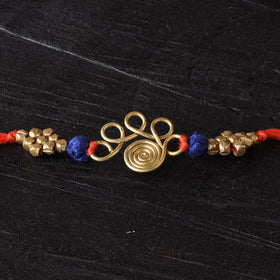 Handcrafted tribal dokra brass thread rakhi 05