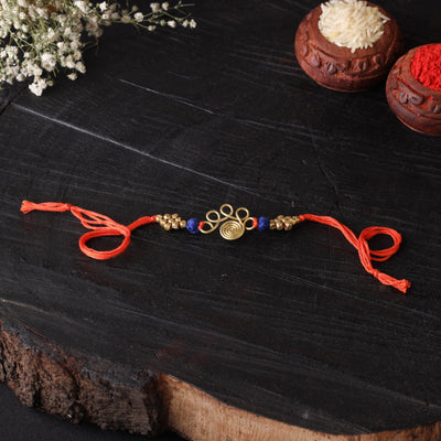 Handcrafted tribal dokra brass thread rakhi 05
