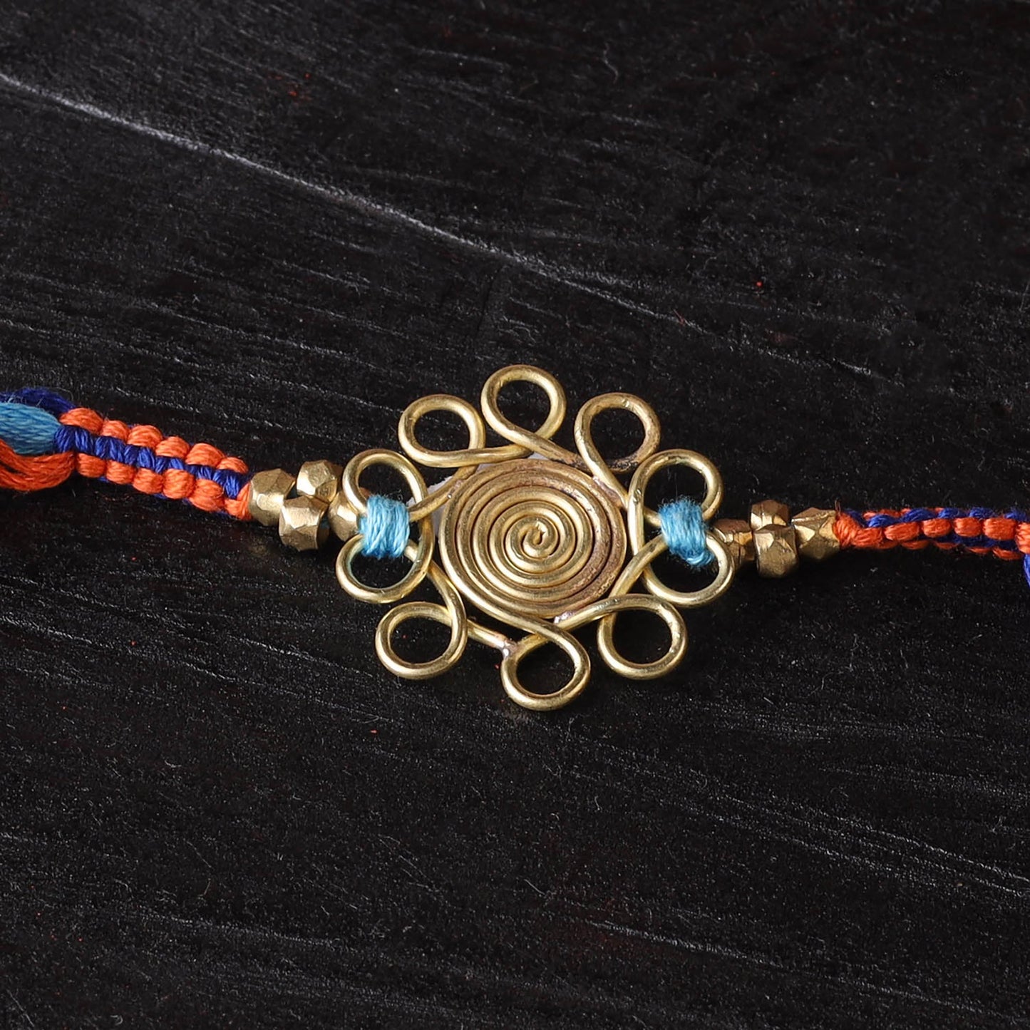 Handcrafted tribal dokra brass thread rakhi 06