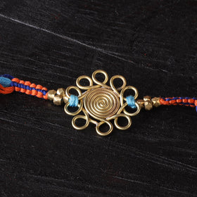 Handcrafted tribal dokra brass thread rakhi 06