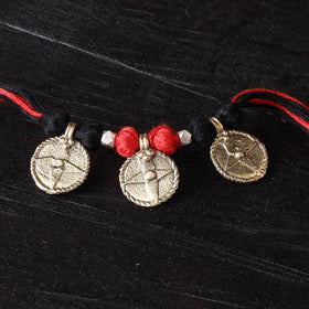 Handcrafted tribal dokra brass thread rakhi 07