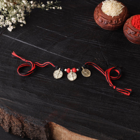 Handcrafted tribal dokra brass thread rakhi 07