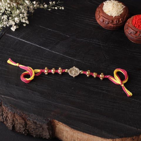 Handcrafted tribal dokra brass thread rakhi 08