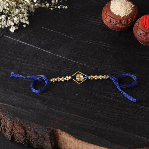 Handcrafted tribal dokra brass thread rakhi 09