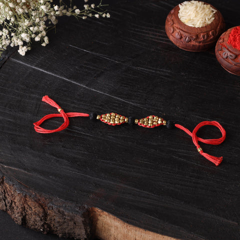 Handcrafted tribal dokra brass thread rakhi 46