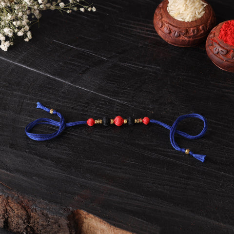 Handcrafted tribal dokra brass thread rakhi 48