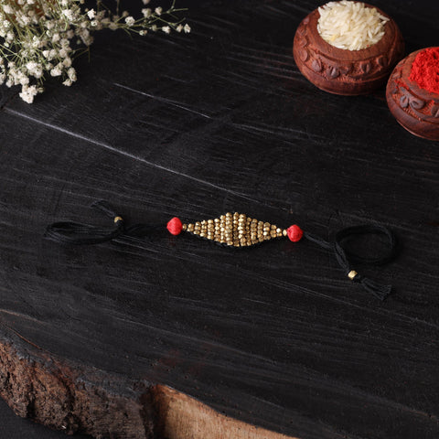 Handcrafted tribal dokra brass thread rakhi 49