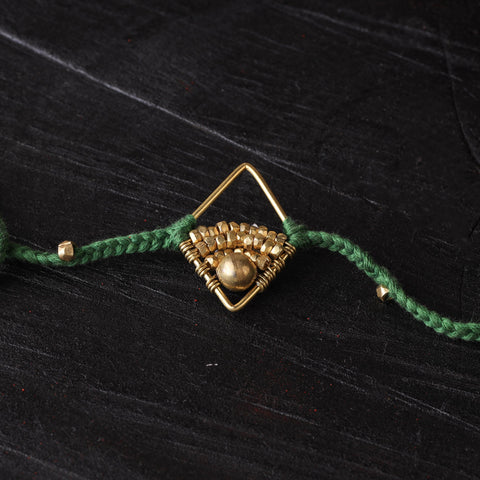 Handcrafted tribal dokra brass thread rakhi 58