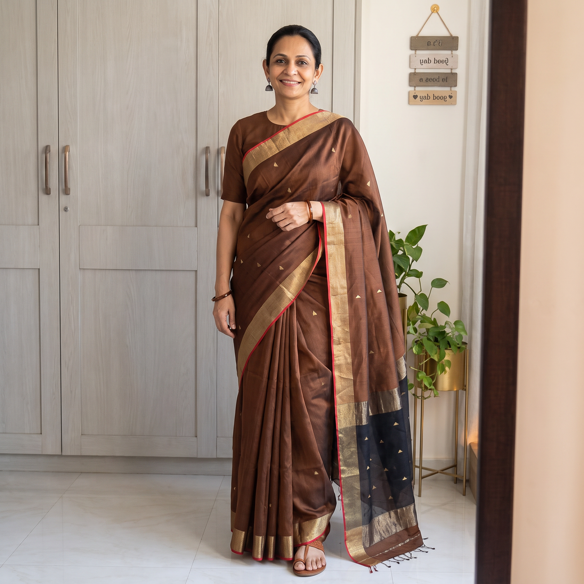 Brown Handloom Buti Maheshwari Silk Saree with Zari Border, draped and worn by a woman, AI visual of the saree, iTokri