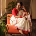 White Handloom Cotton Burdwan Jamdani Saree, draped and worn by a woman, AI visual of the saree, iTokri